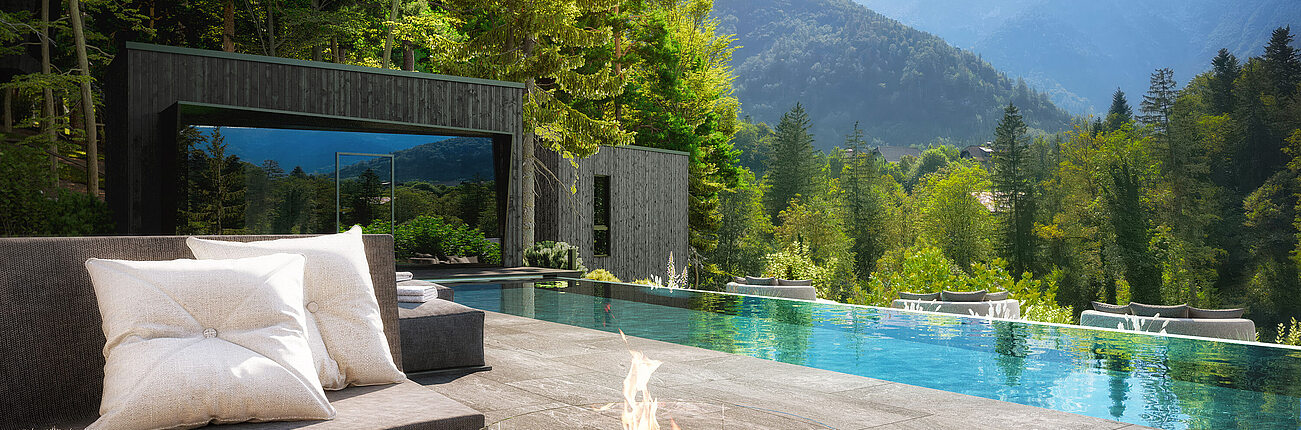 Luxury outdoor area with pool, fire pit, and forest view